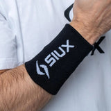 Siux Basic 26 long padel wristband in black with a white logo
